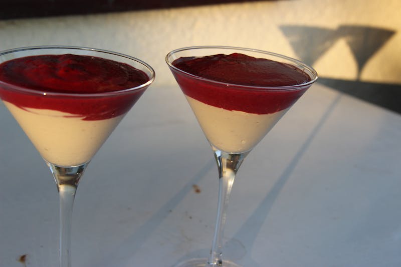 Panna cotta Italian dessert with berry sauce